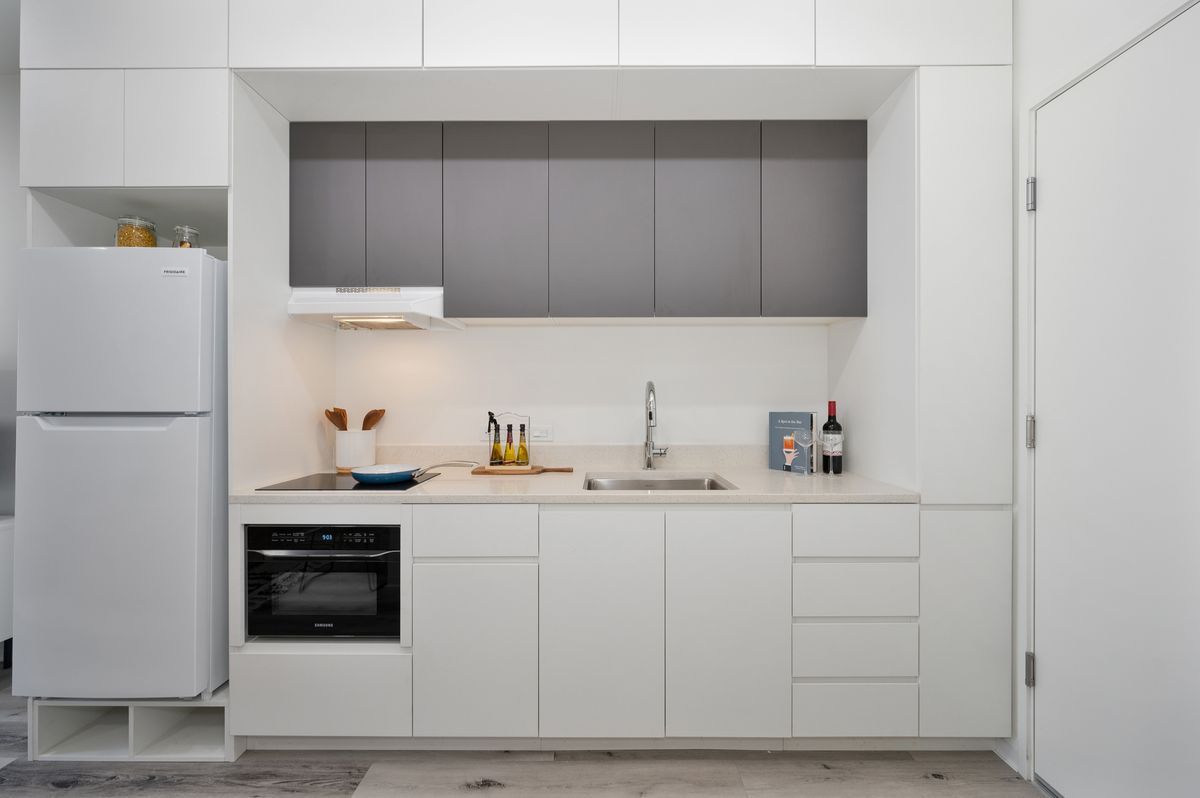 Modern kitchen and living area with quartz countertops